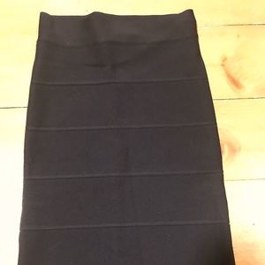 Stretchy knee length, high rise skirt.
